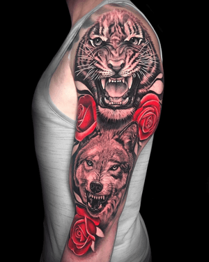 One of my favorite half sleeves done recently at @gritnglory ❤️🐯🌹🐺
