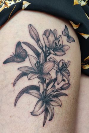 Whip shaded lilies with butterflies.