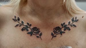 Rose tattoo near the collar bone.