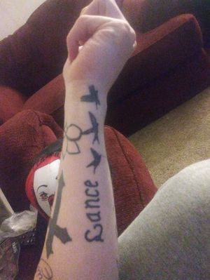 My cousins name and 3 birds on the inside of my left forearm/wrist