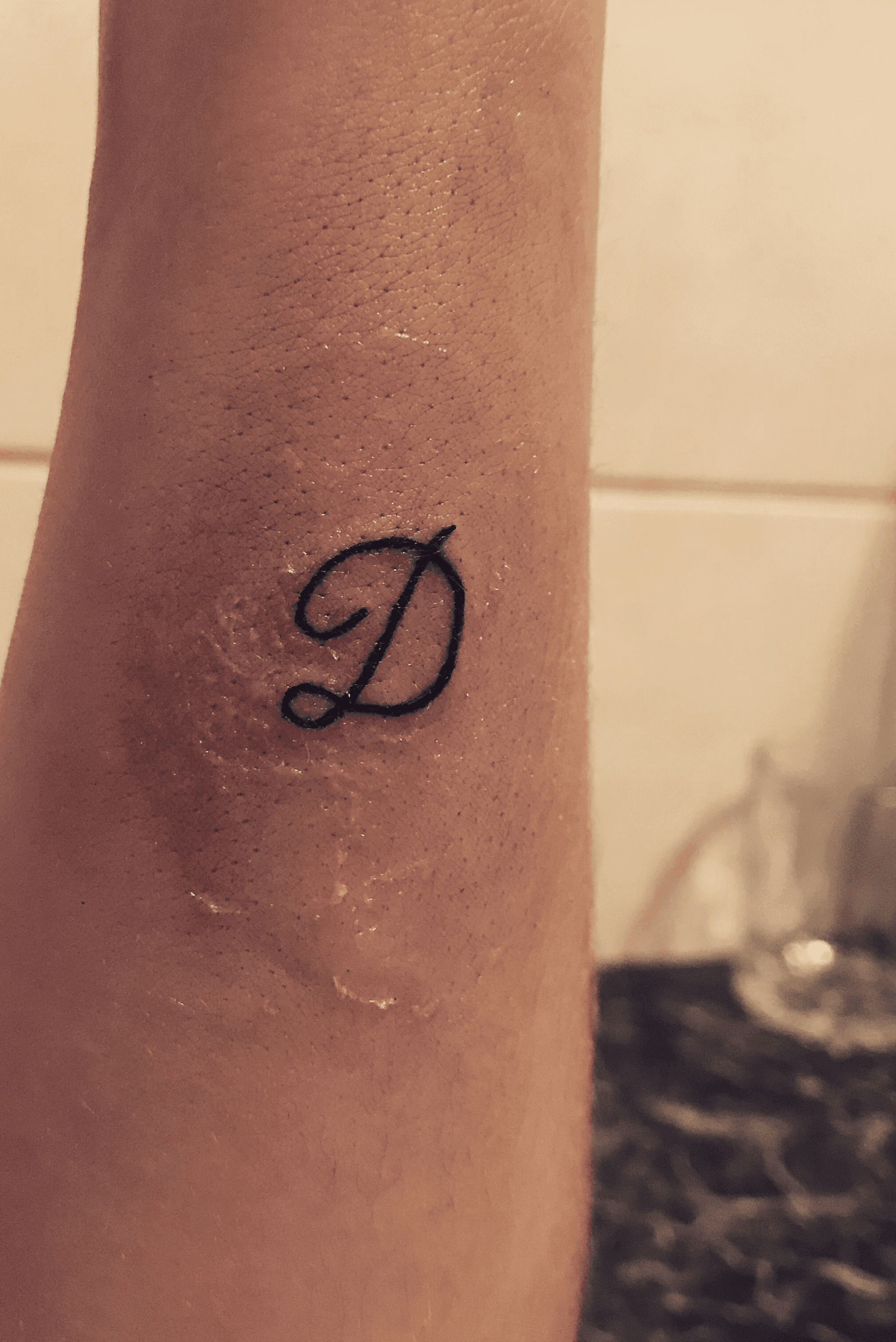 letter d tattoo