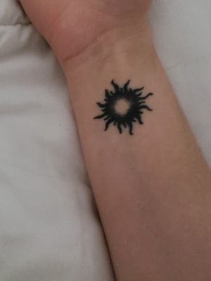 This is my itty bitty sun tattoo on my wrist. My current boyfriend has the moon. Kind of a spur of the moment thing, and I LOVE it.