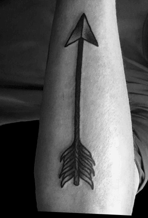Traditional black and white bold arrow on forearm backside. 