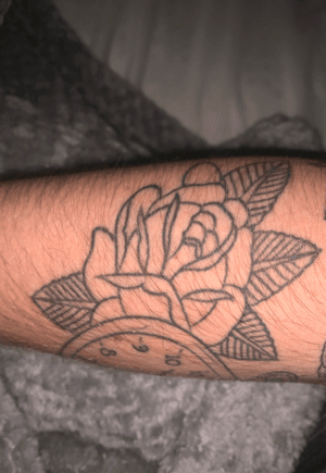 Traditional rose connecting with a earlier timepiece design for the start of a traditional arm sleeve.