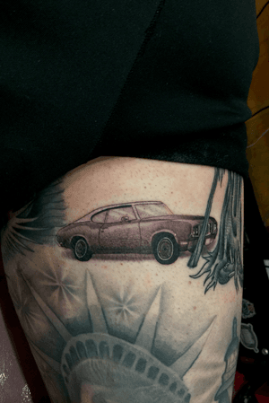 Small small tattoo on the back of his leg sleeve. This was his first car he got while in high school. 