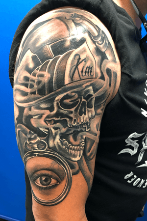 Firefighter piece covering an old cross and ex’s name #coverup #firefightertattoo #nonames #blackandgrey #sleevetattoo #skulls #eyes #inked
