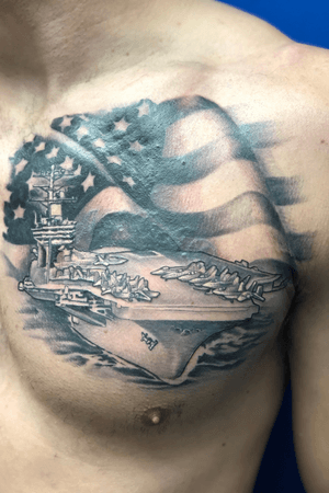 Aircraft carrier and flag covering an ex’s name #coverup #militarytattoos #flagtattoo #american #blackandgrey #patriotictattoo 
