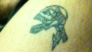Skull with Confederate skull. Color has faded and it's only the size of a 50 cent piece want covered up asap will get anything as long as it's covered