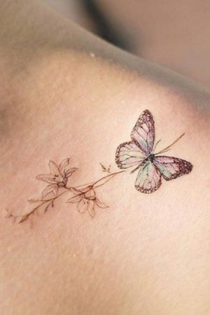 Butterfly on a Plant tattoo#color #flowers 