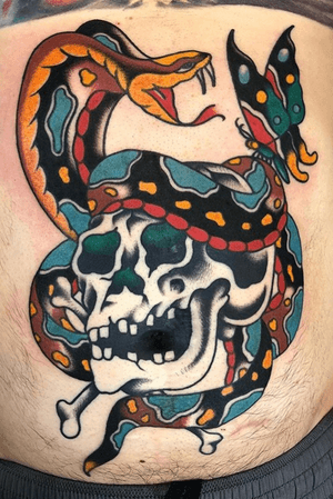 Cobra skull and butterfly stomach tattoo made by Brent Mccarron at the Bell Rose in Daphne, Alabama. 