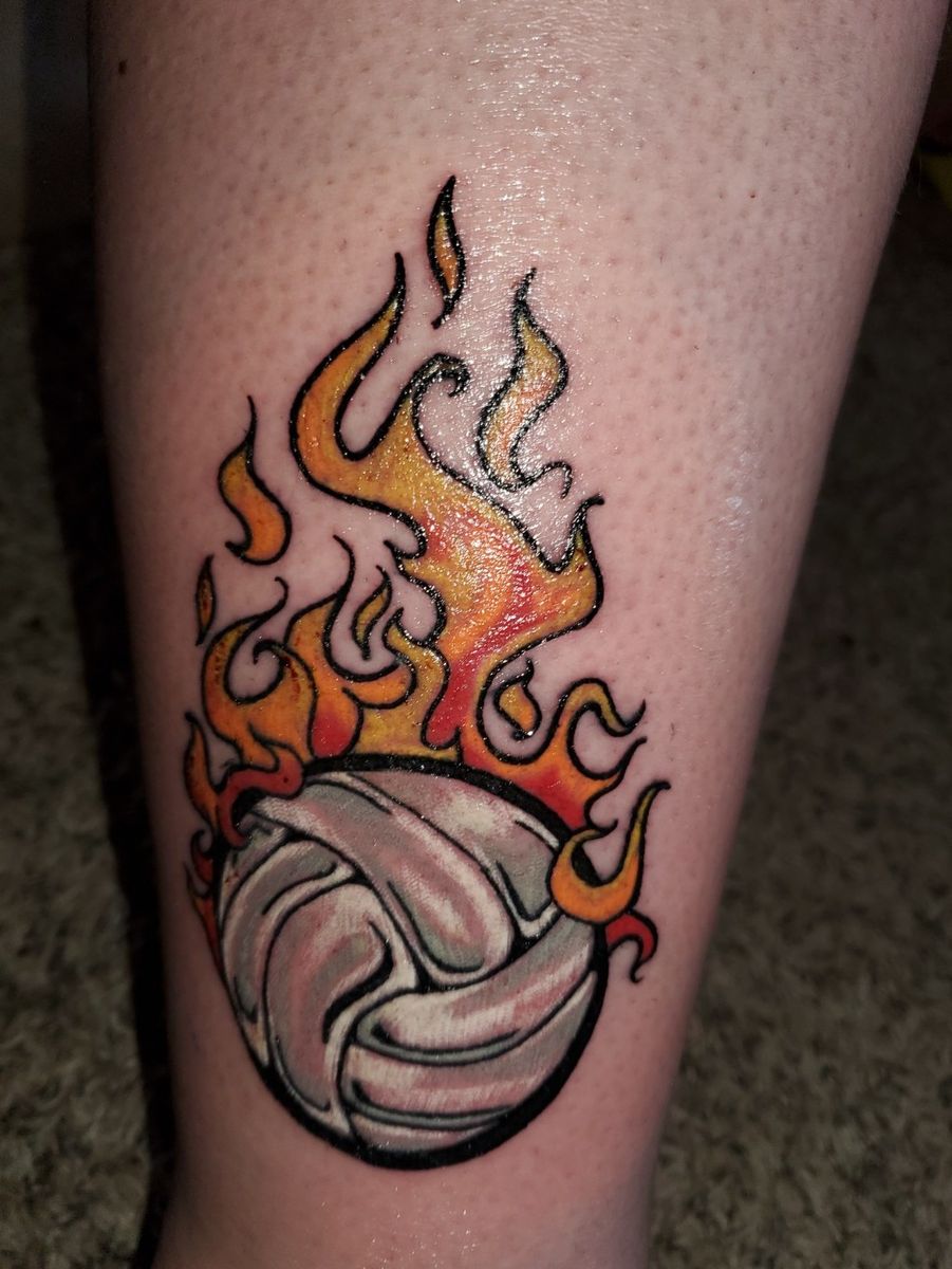 Tattoo uploaded by Jami King • Flaming volleyball close to the ankle