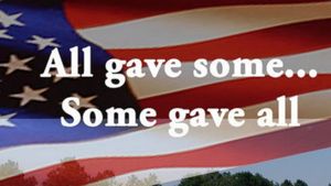 "All gave some...Some gave all"On a waving U.S. flag background 