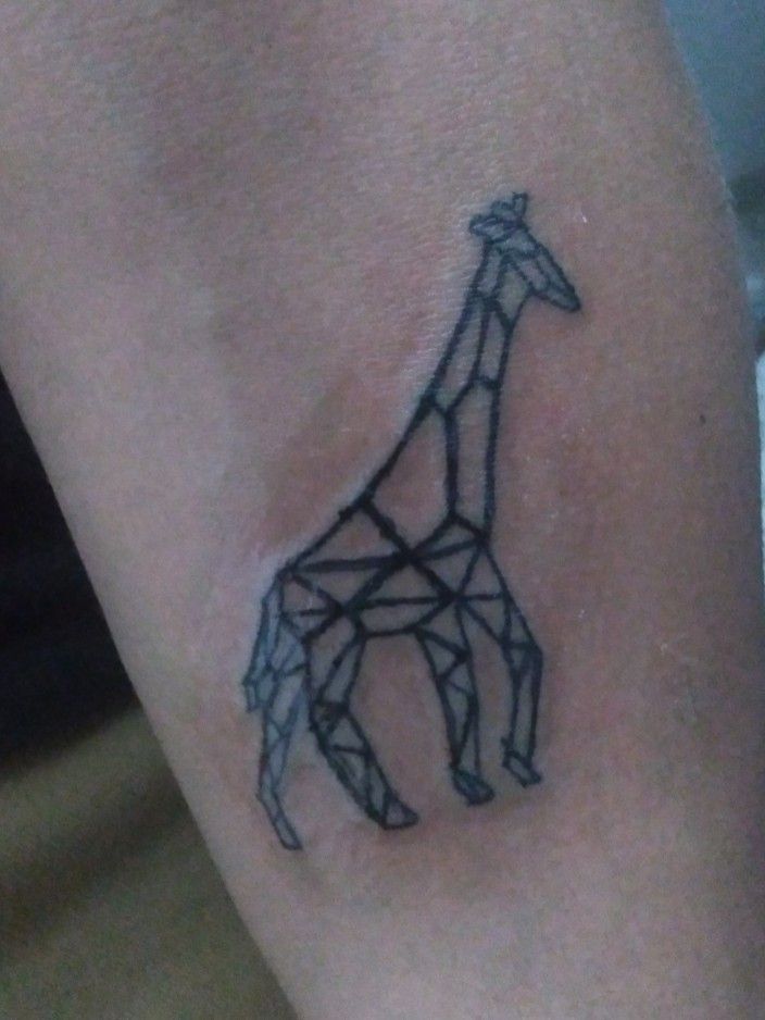 Giraffe tattoo on the right bicep
