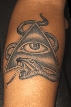 Freehand snake and all seeing eye