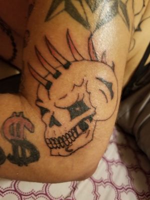 Skull with spikes on Tyler's arm