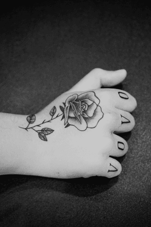 Rose tattoo and finger lettering
