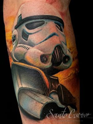 Get a stunning realism tattoo of a stormtrooper done by artist Alex Santo. Stand out with vibrant colors on your forearm!