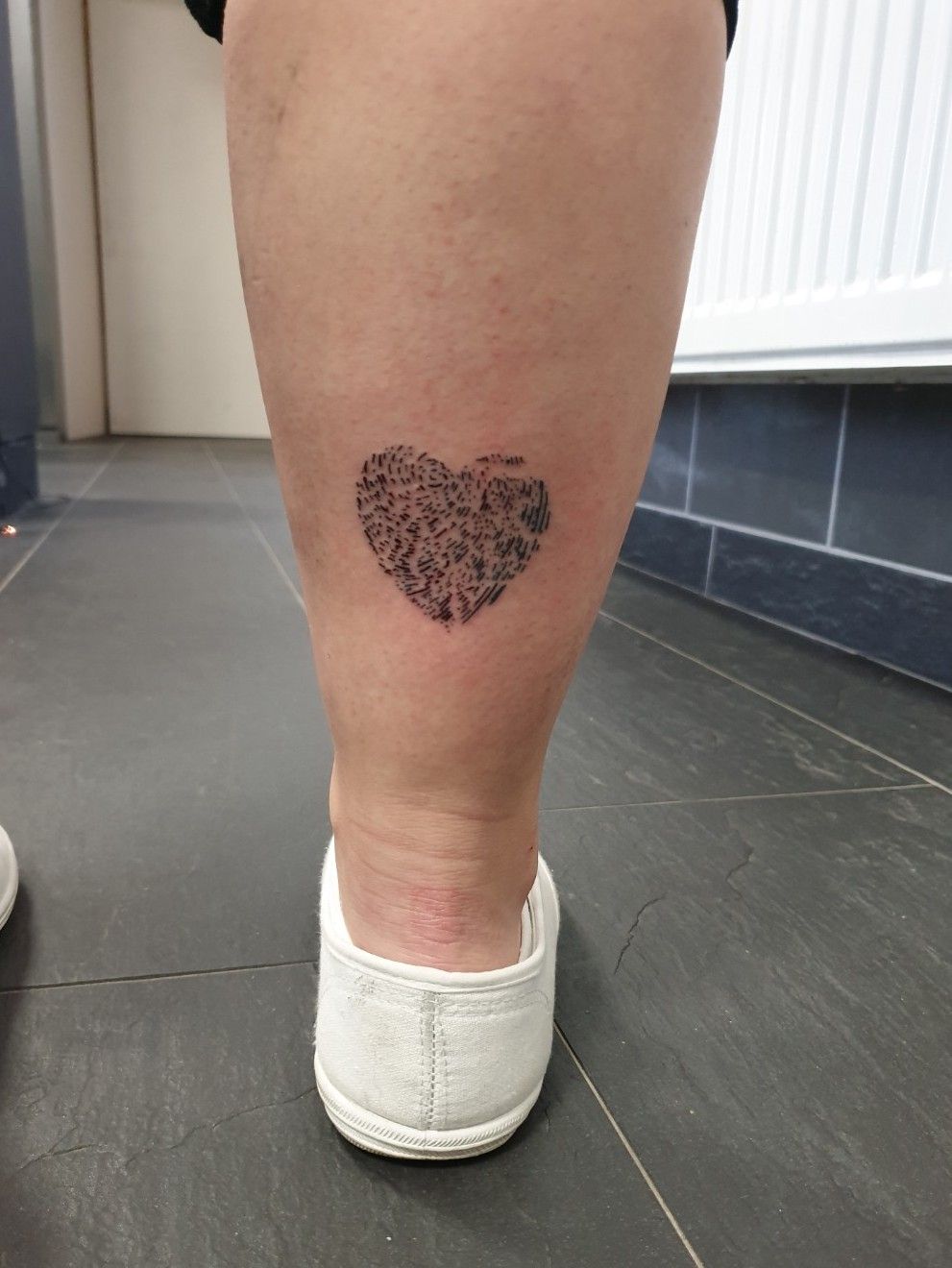 heart shaped fingerprint tattoo