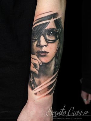 Get a stunning black and gray tattoo masterpiece by artist Alex Santo. Showcase a beautiful woman's portrait on your forearm.