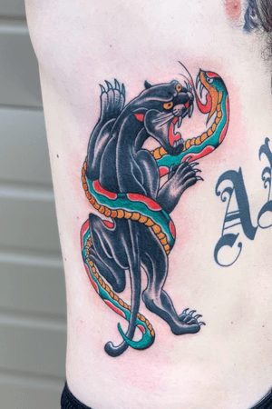 Panther vs. Snake #Boise #Idaho #tattooartist #tattoo #tattoos #ink #tattooart #inked #art #tattooed #tattoolife #artist #tattooer #tattoodesign #tattooideas #tattoostyle #tattooshop #bodyart #instatattoo #tattoosofinstagram #drawing #americanatattoos #AmericanTraditional #ribtattoo #panther #snake 