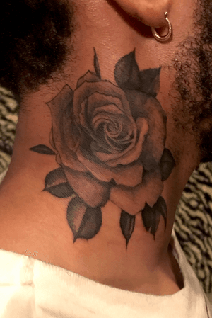 Neck rose tattoo