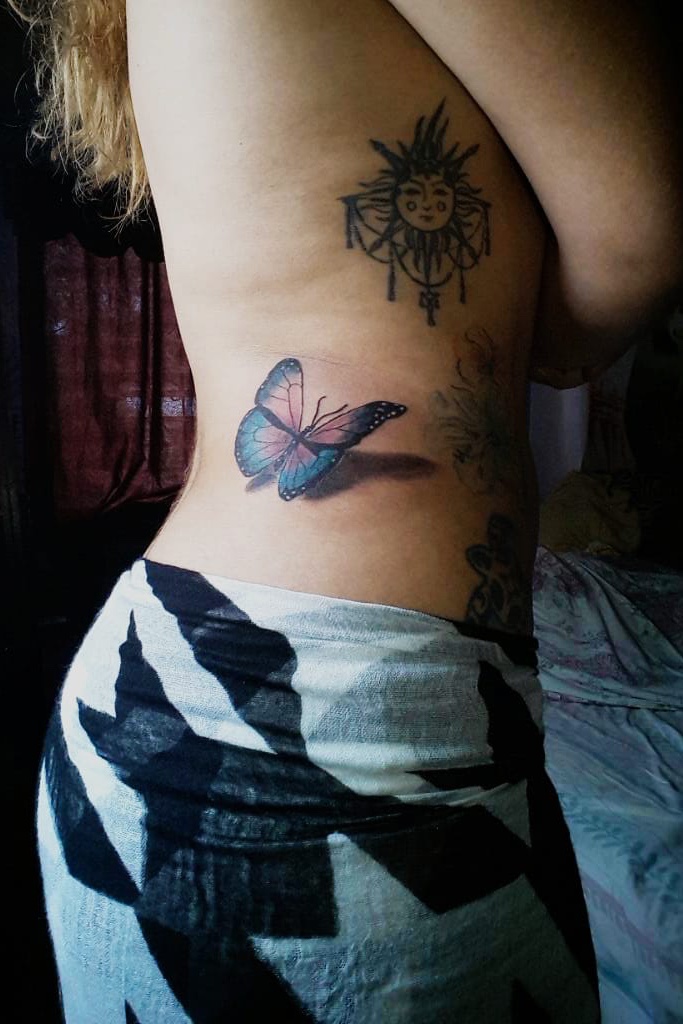 butterfly tattoos on side of stomach