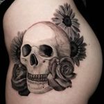 Skull and floral on hip. #skull #skulltattoo #floral #floraltattoo #realism #realistictattoo #blackandgrey #blackandgreytattoo #girlswithtattoos #knoxville #knoxvilletattoo