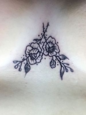Freehand floral sternum tattoo