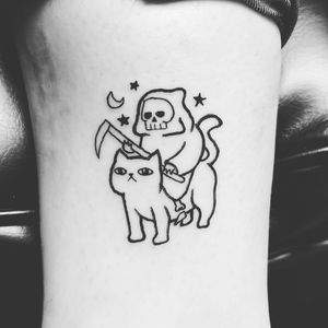 Death cat tattoo above ankel 