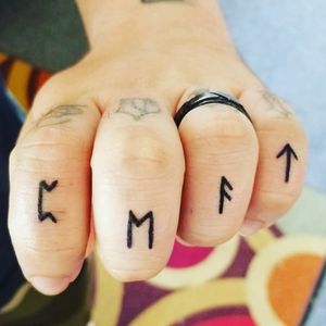 Family name rune finger tattoo