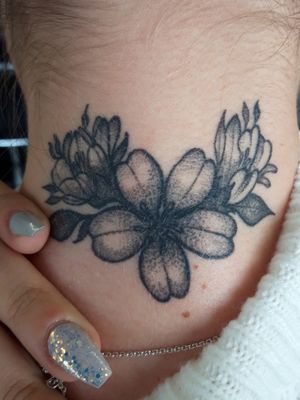Healed, back of the neck floral tattoo