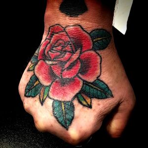 Healed rose hand tattoo by Scott Johnson