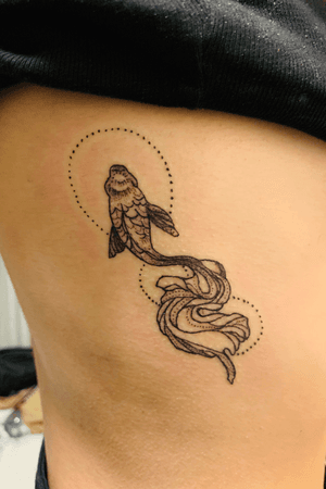 black and grey dot style fish on the ribs