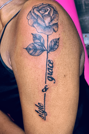 black and grey rose and letting tattoo 