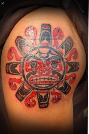 From: tattoostime.com #Colored #Aztec #upperarm #blackandredtattoo 
