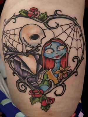 Justin did this colorful #jackandsally #nightmarebeforechristmas tattoo #thigh #flowers #floral #animation