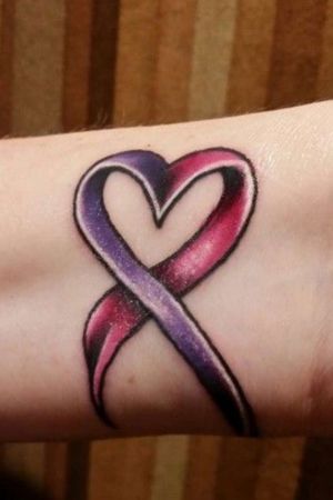 Again, not my tat. RED and PURPLE awareness ribbon to symbolize suicide/depression/alcohol/substance abuse. I hold the importance of these ribbons near and dear to my heart on a very personal level-both for myself and for friends/family.