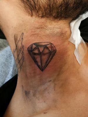 Diamond on neck tattoo