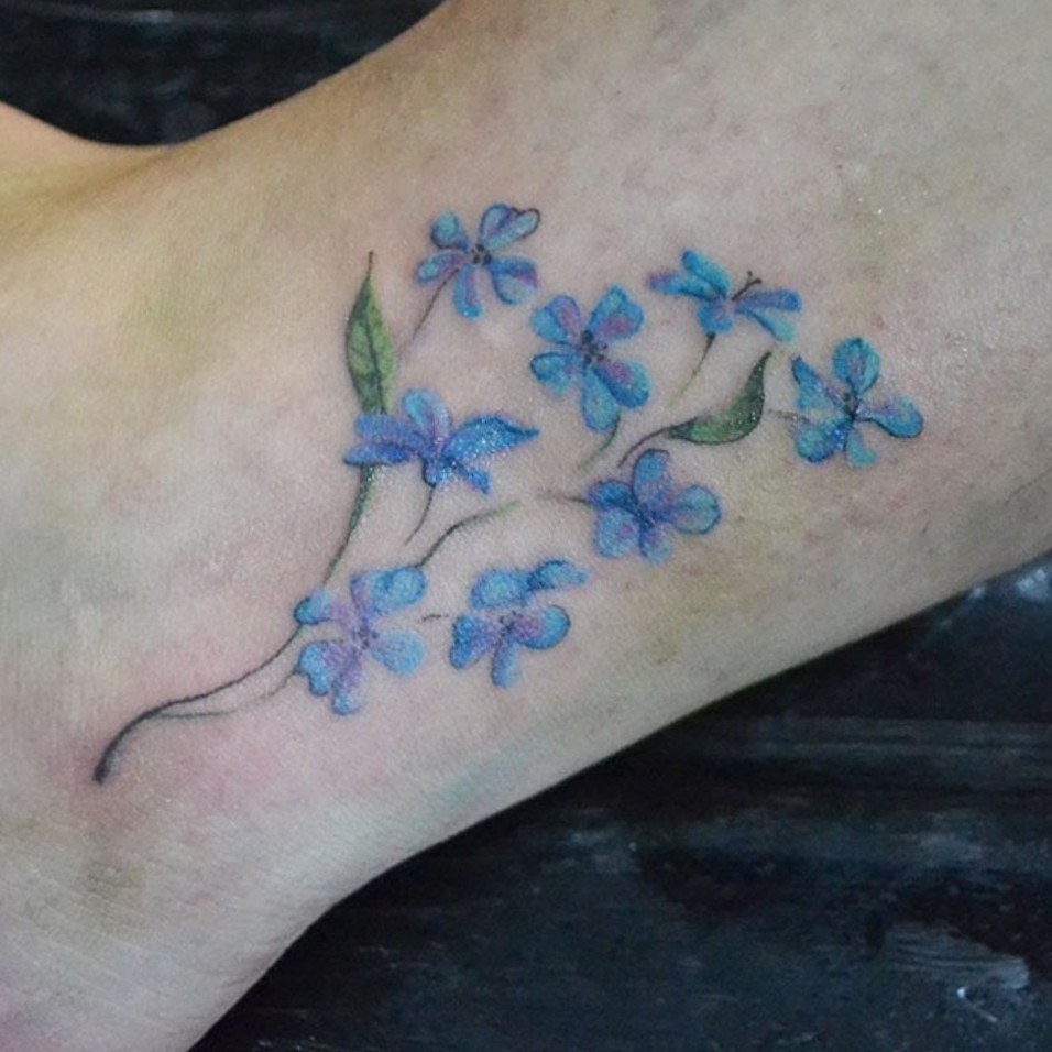 forget me not foot tattoo