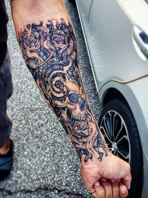 Awesome skull/clock morph forearm piece I got to do! Clock, skull and bottom rose a few weeks healed, the top roses and some white fresh!