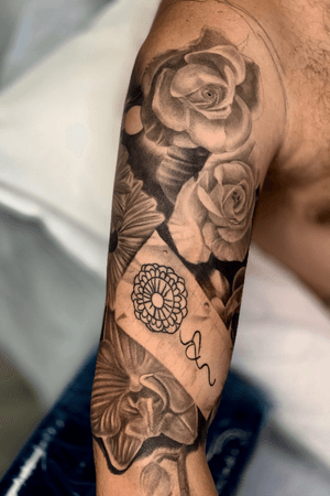 Full sleeve floral tattoo
