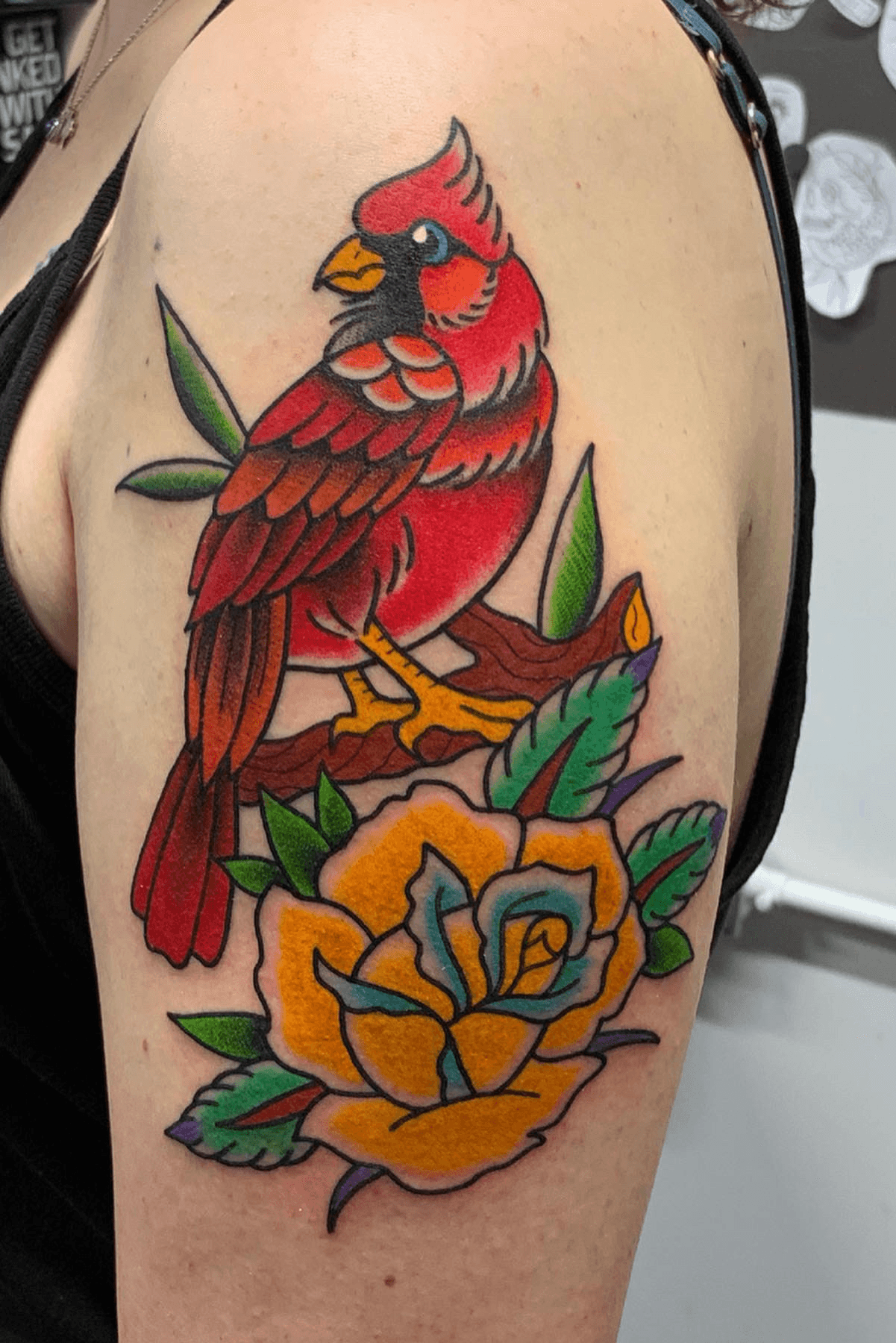 Neotraditional bird tattoo on the inner arm