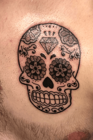 Got this tattoo with my mom. We have matching tattoos. She is the one who inspired me and got me really into tattoos and I just wanted something to show the bond we share over not only tattoos but day of the dead culture.