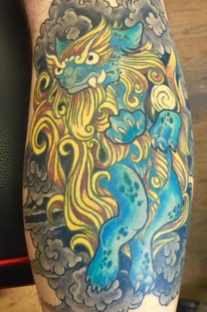 Okinawan Shisa Dog on my right calf. Lineart was originally designed by a friend and had tattooed on in San Angelo, TX. Later colored in and smoke added in Denver, CO by "Wolfman" Frank.