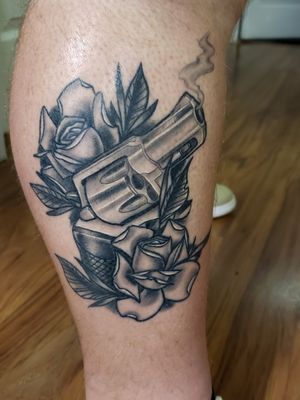 Healed revolver tattoo