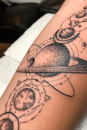 Close up fine line galaxy on forearm