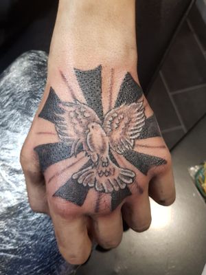 Dove hand tattoo