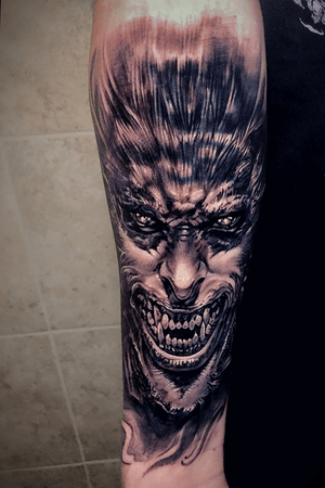 Black and grey Cover-Up werewolf tattoo
