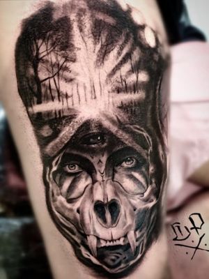 Discover the haunting beauty of this black and gray tree and skull tattoo on the upper leg, masterfully executed by Mauro Imperatori.