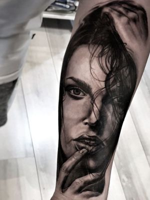 Capture the beauty of a woman with this stunning black and gray tattoo by Mauro Imperatori. Perfect for those seeking a detailed and lifelike design.